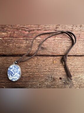 Beautiful blue and white pendant on Suede Cord.